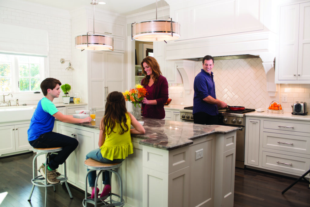 Father, mother, daughter, son in family kitchen